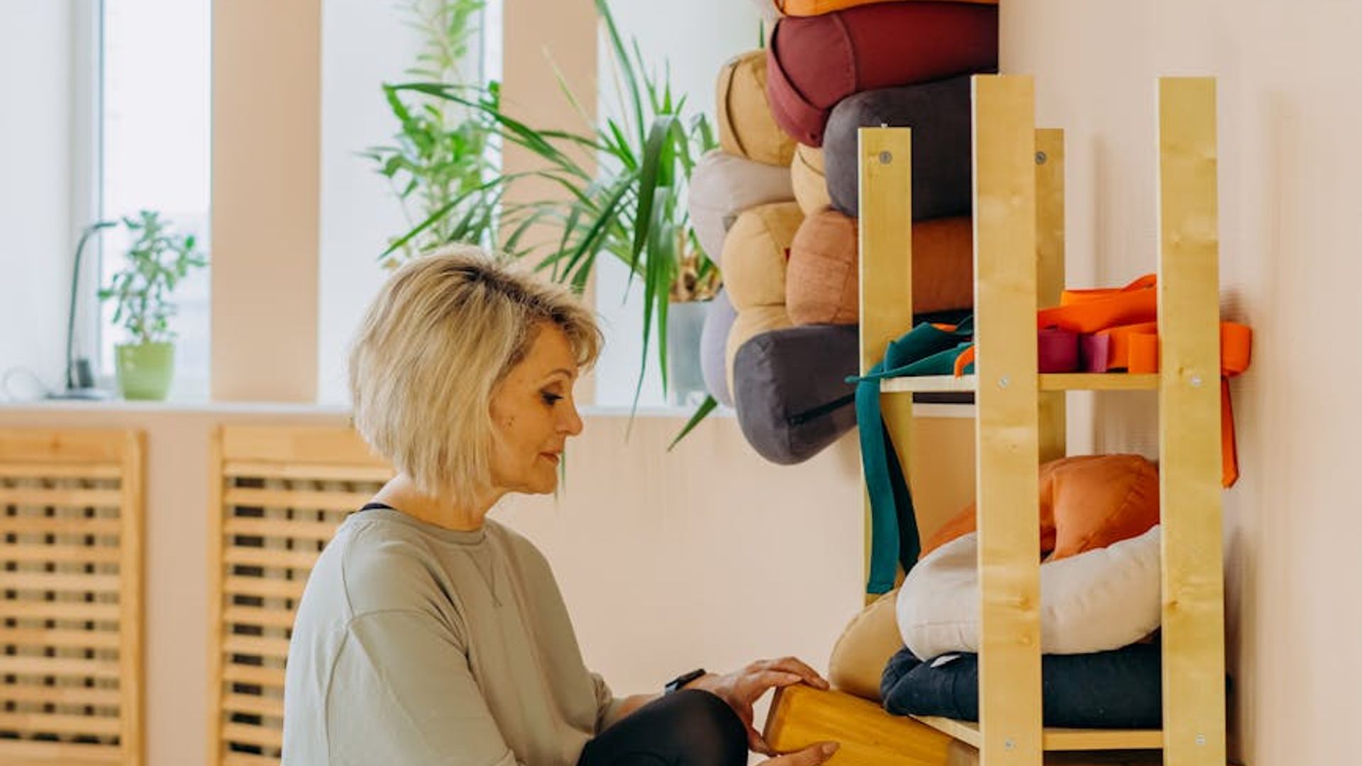 Serene yoga studio with natural light and wooden floor